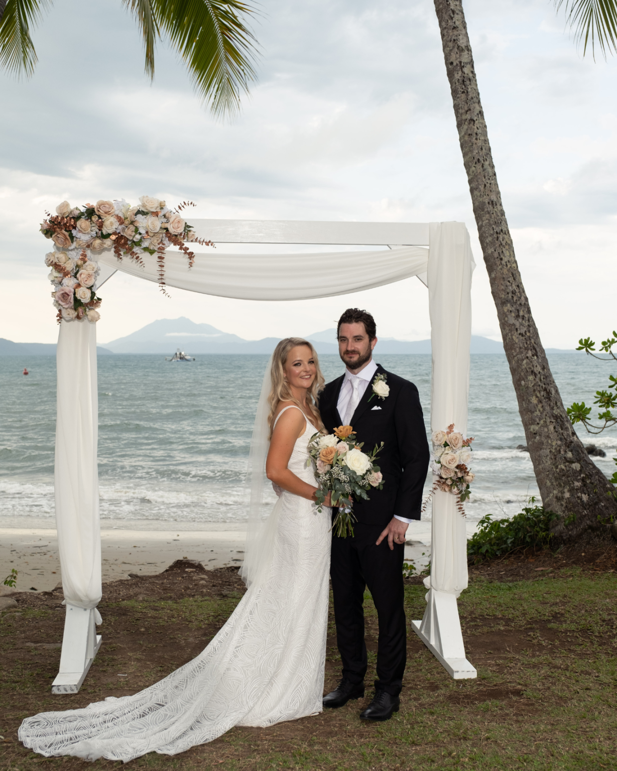 Melaleuca Resort - Palm cove weddings - bride and groom right in front of beach
