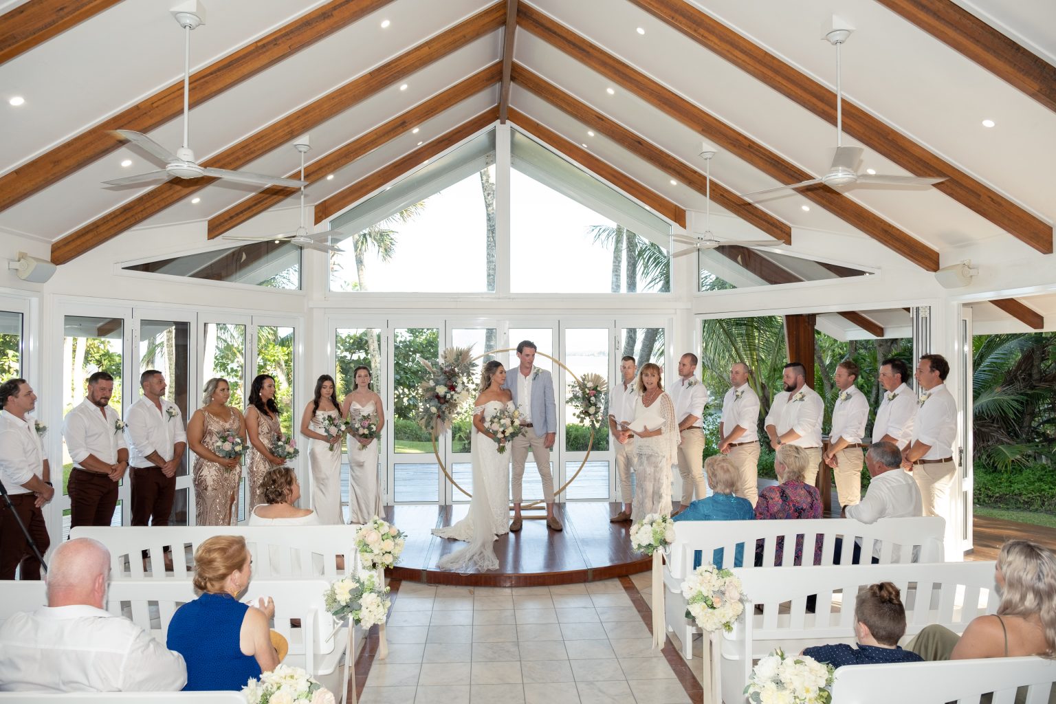 Melaleuca Resort - Palm cove weddings - bride and groom in church surrounded by family and friends