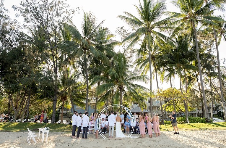 Melaleuca Resort - Palm cove weddings - bride, groom and cohort right in front of beach