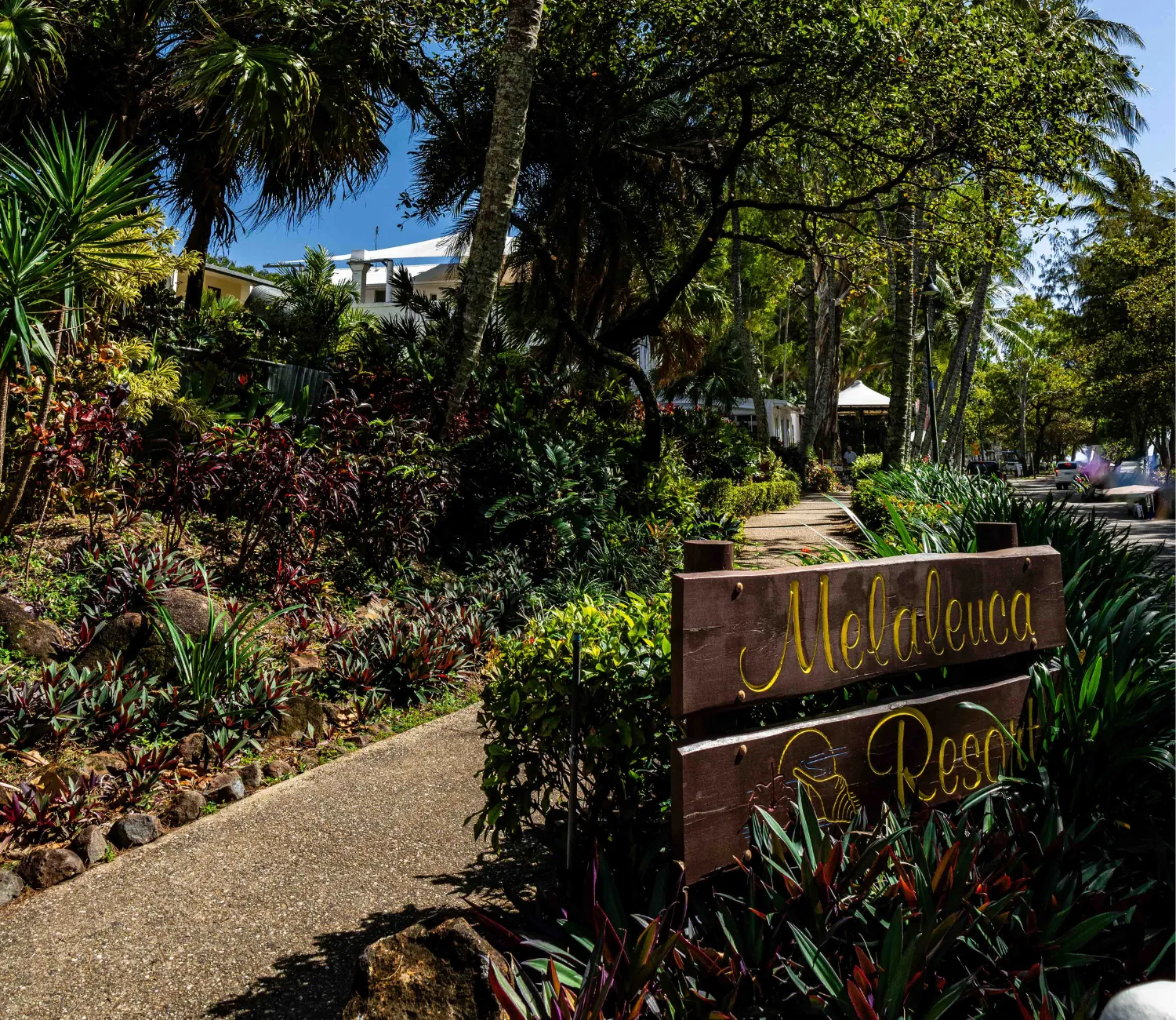 Pathway and gardens with Melaleuca Resort Signage